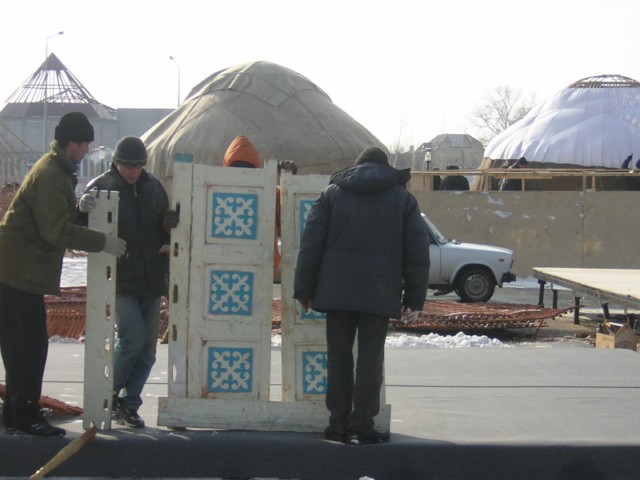 For fancy yurts, step one is to put up the door. Simpler yurts have no door, only a doorway.