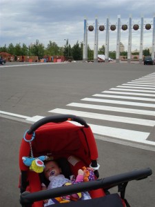 Anna At Entrance To Astana Park, With Yurts In The Background