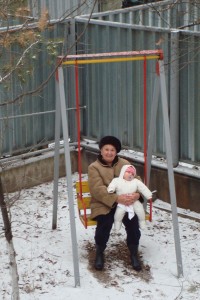 Anna and Babushka on the swing